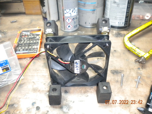 fan attached to hinges